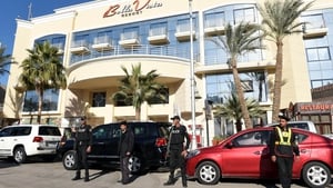 Egyptian police and security personnel stand guard in front of the Bella Vista Hotel in Egypt's Red Sea resort of Hurghada