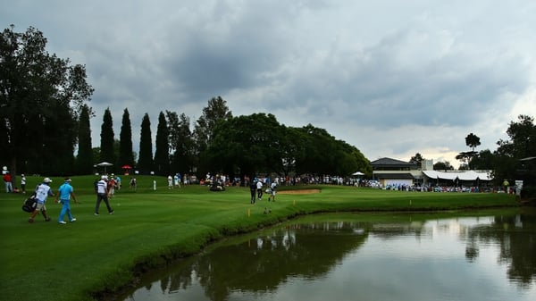 Storm clouds gather over Glendower Golf Club as players walk off after third round play was suspended