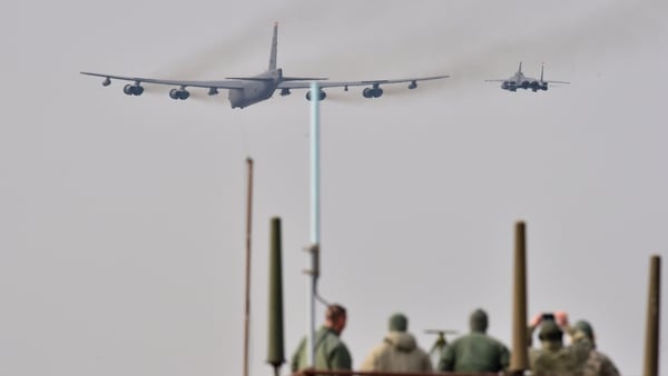 The B-52 was flanked by two fighter planes, a US F-16 and a South Korean F-15, in a low flight over Osan Air Base, south of Seoul