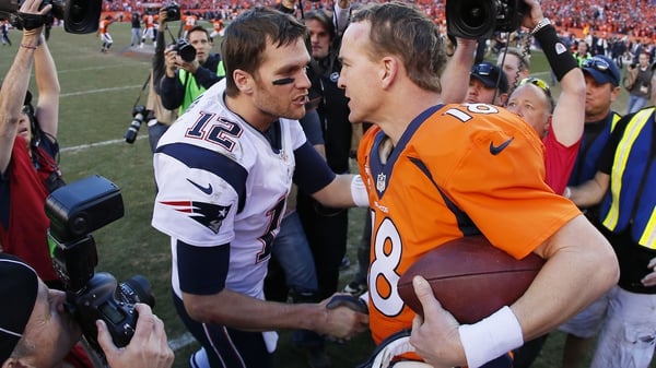 Tom Brady (L) and Peyton Manning after the Broncos' AFC Championship win in 2014