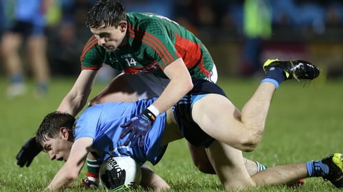 Michael Fitzsimons of Dublin and Jason Doherty of Mayo grapple for possession