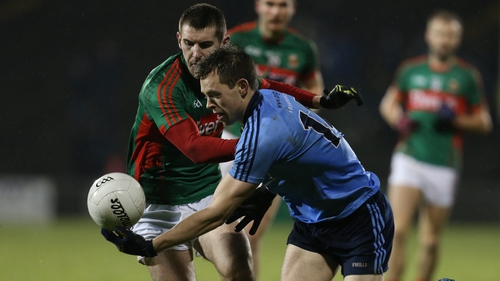 Dean Rock of Dublin spins away from Mayo's Caolan Crowe