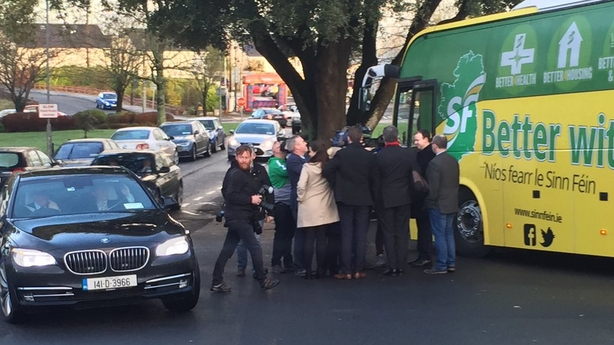 Taoiseach arrives just as Gerry Adams is leaving. Pic: Pat McGrath, Twitter