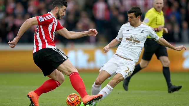 50/50 ball for Graziano Pelle of Southampton and Swansea's Jack Cork