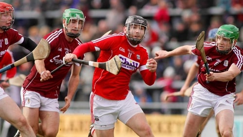 Paudie O'Sullivan of Cork is hounded by Galway's Padraig Mannion and Adrian Tuohy
