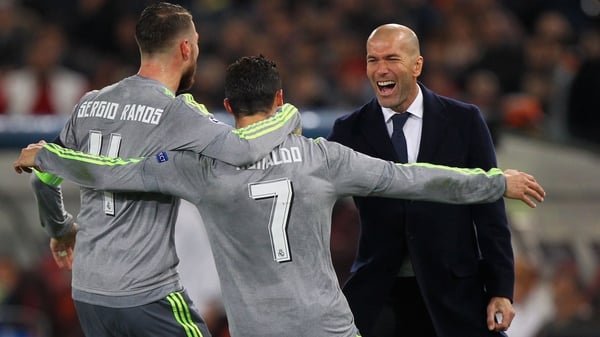 Cristiano Ronaldo celebrates with Sergio Ramos and Zinedine Zidane after scoring the opening goal