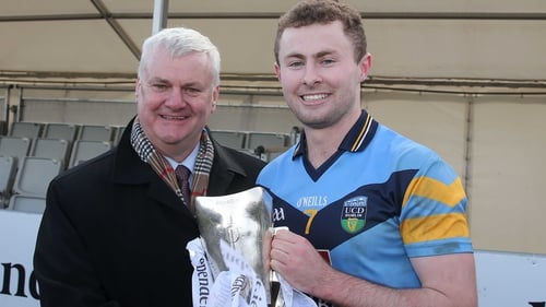 GAA President Aogán O Farrell presents the Sigerson Cup to UCD captain Jack McCaffrey