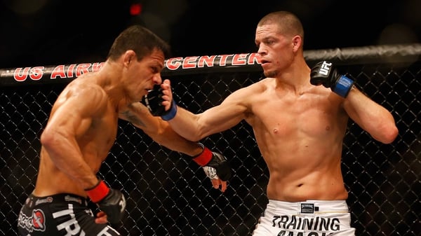 Rafael dos Anjos takes a hit from Nate Diaz in the 2014 lightweight bout, which the Brazilian won