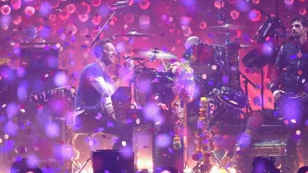 Coldplay performing on stage