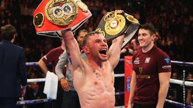 Carl Frampton with his two belts