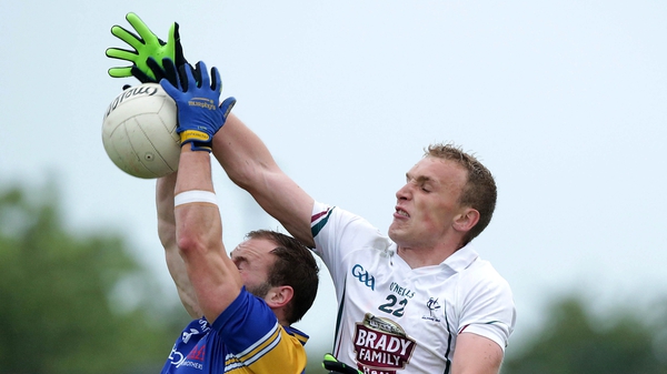 Kildare goalscorer Tommy Moolick jumps for a ball against Longford