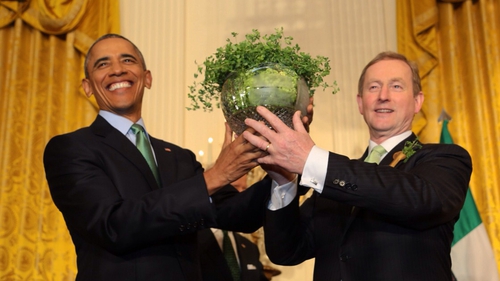 Barack Obama is presented with a bowl of Shamrock by Enda Kenny