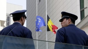 Japanese policemen stand guard outside the Belgian Embassy in Tokyo, Japa