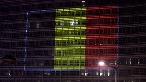 A Belgian flag made of coloured lights appears on the Berleymont European building in Brussels