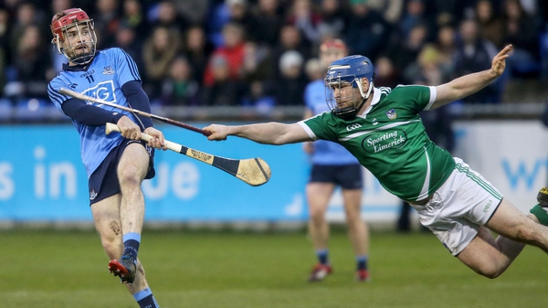 Dublin's Niall McMorrow gets the ball away under pressure from Richie McCarthy of Limerick