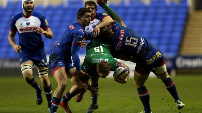 Grenoble's Robinson Caire (L) and Julien Caminat see to Andrew Fenby of London Irish