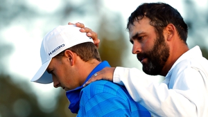 Spieth is consoled by his caddie after last year's final round at Augusta
