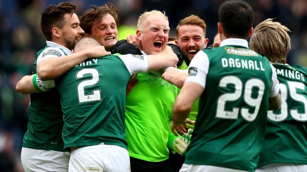 Hibs 'keeper Conrad Logan is mobbed at the end