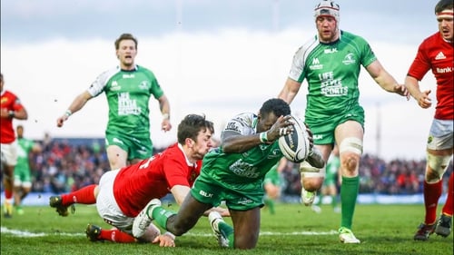 Niyi Adeolokun evades Darren Sweetnam to score Munster's third try at the Sportsground