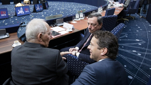 Jereon Dijsselbloem, head of the eurozone ministers, speaks to German minister Wolfgang Schaeuble and Mario Draghi of the ECB