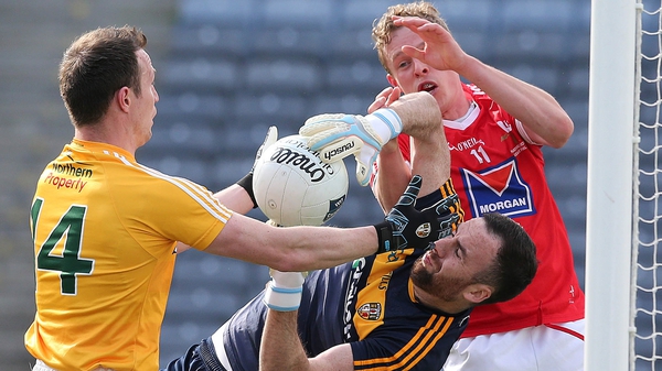Antrim's Chris Kerr under pressure from Jim McEneaney of Louth