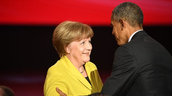 Angela Merkel and Barack Obama are seen on stage at the opening evening of the Hannover Messe trade fair