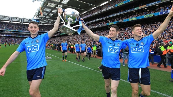 Cormac Costello, Diarmuid Connolly and Paul Flynn celebrate after winning a fourth League title on the bounce