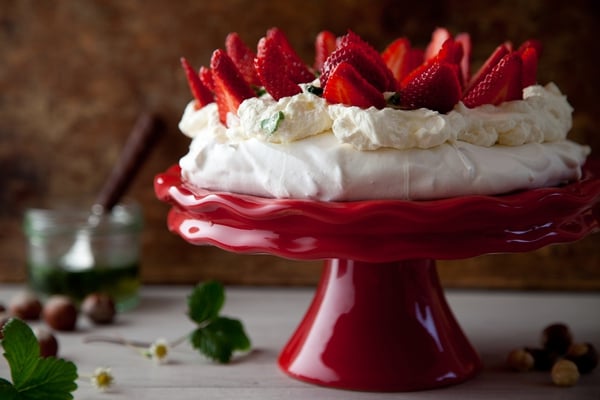 Hazelnut Pavlova with Summer Strawberries, Mascarpone Cream and Basil Drizzle