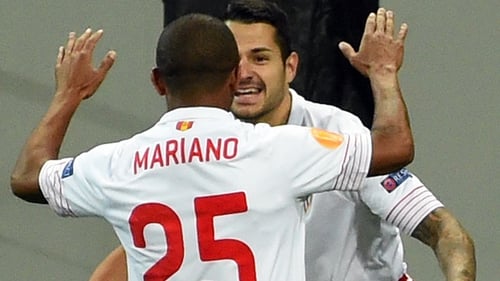 Sevilla's Vitolo and Mariano celebrate against Shakhtar Donetsk