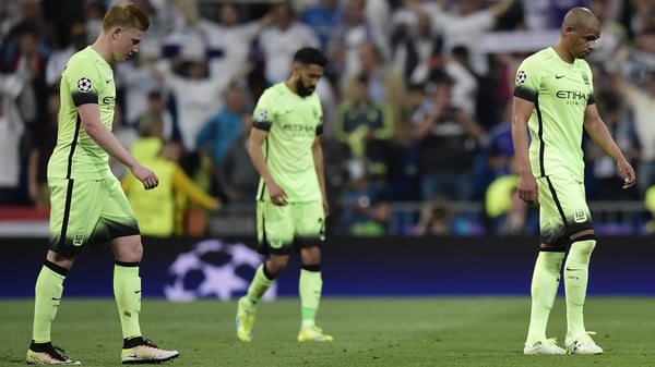 Dejected Man City players traipse from the Bernabeu pitch