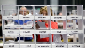 A count supervisor sorts voting papers at the Titanic Exhibition Centre, Belfast