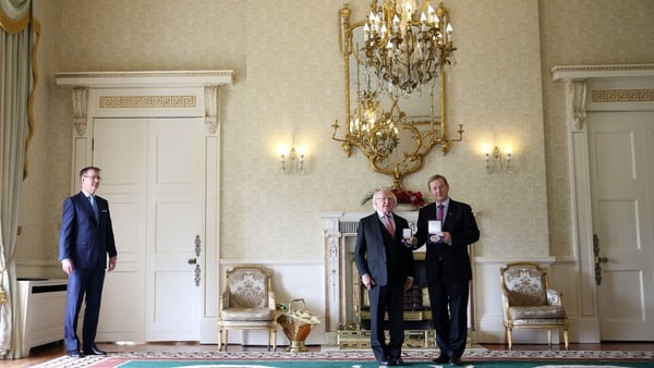 Enda Kenny receives his seal of office from President Michael D Higgins