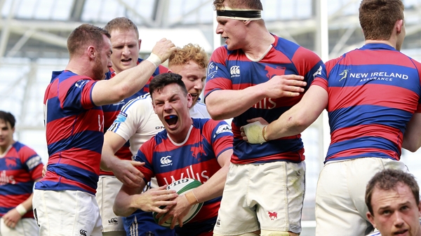 Clontarf's Matt D'Arcy celebrates his try with teammates