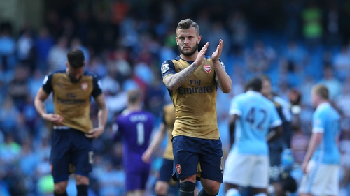 Jack Wilshere applauds the Arsenal fans who made the trip to the Etihad Stadium