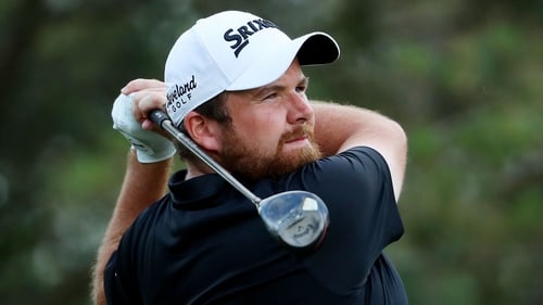Lowry watches another accurate tee shot during his second round at Sawgrass