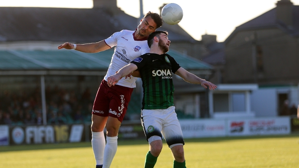 Ryan Brennan of Bray and Galway's Armin Aganovic battle it out in the air