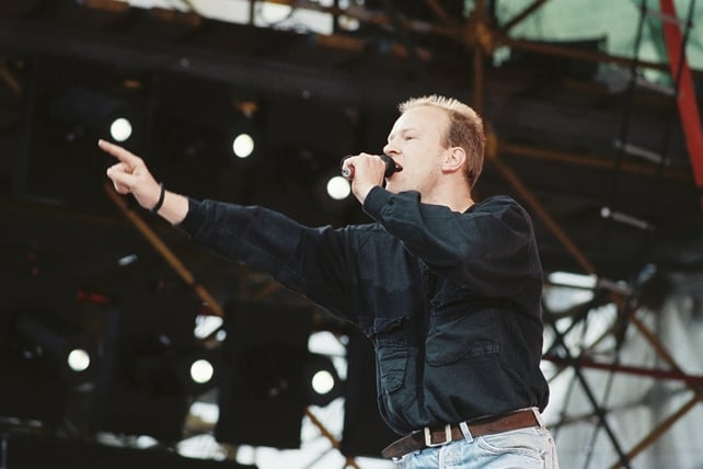 Singer Derek Herbert of Les Enfants on stage during 'Self Aid' (1986)
