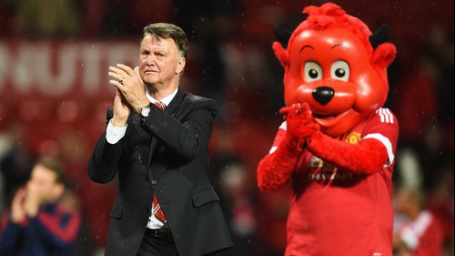 Louis van Gaal and Fred the Red applaud fans at Old Trafford