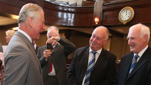 Prince Charles shares a joke with members of Portaferry GAA club at an event yesterday