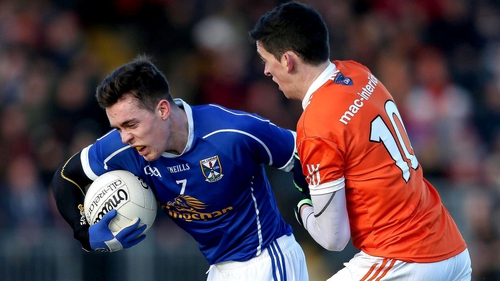 Armagh's Rory Gugan tackles Cavan's Dara McVeety in the Dr McKenna Cup