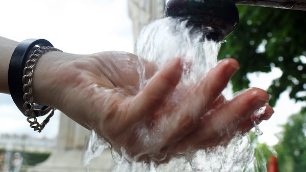 Simon Coveney said the issue of how water is paid for needs to be settled once and for all