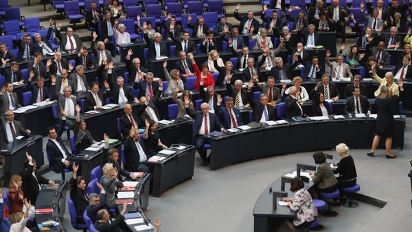 MPs approve with a show of hands a resolution to recognise the 1915 Armenian genocide