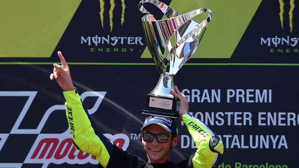 Valentino Rossi held off Spanish rival Marc Marquez to claim victory in a thrilling duel over the final six laps