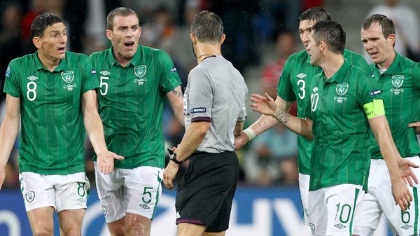 Ireland's players surround the referee during the loss to Croatia
