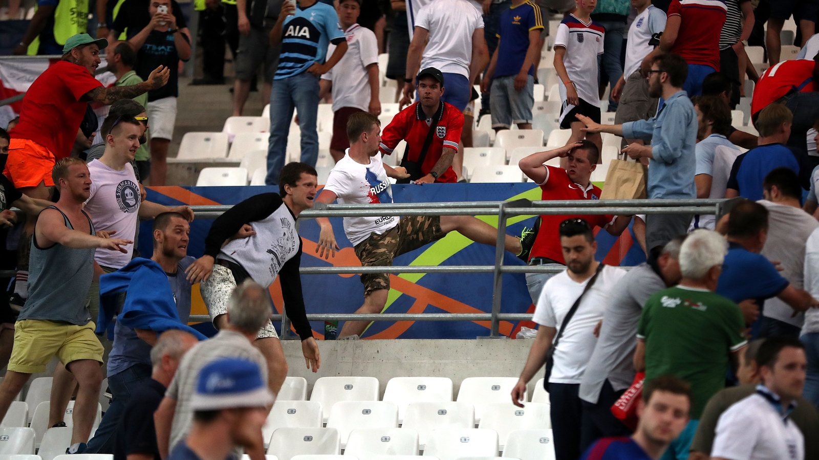 Fans fight in stadium and on Marseille streets