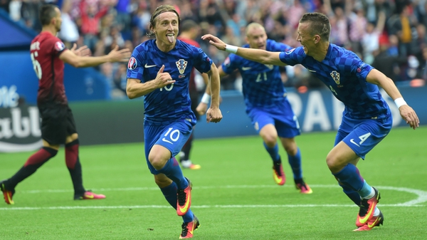 Luka Modric wheels away in delight after his winner