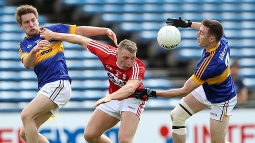 Tipperary duo Bill Maher and Alan Campbell battle Brian Hurley of Cork