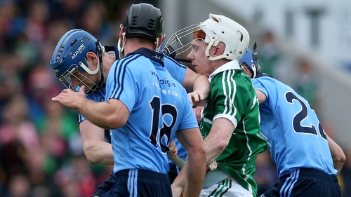 Lynch finds himself under pressure from three Dublin players during last year's All-Ireland qualifiers.