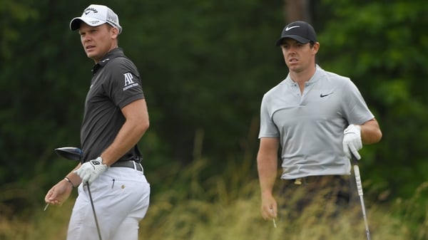 Willett and McIlroy during their first round at Oakmont, which was cut short due to thunder storms