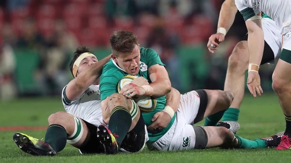 Craig Gilroy is tackled by Francois Louw in Johannesburg
